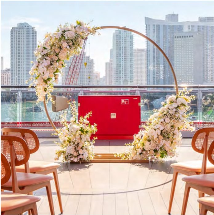Luxe Chic arch with white florals and gold ring